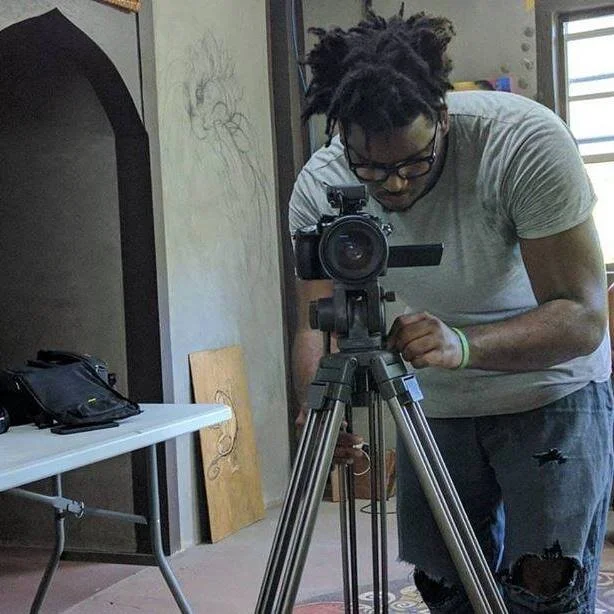 Norris Francois Jr operating a camera on location